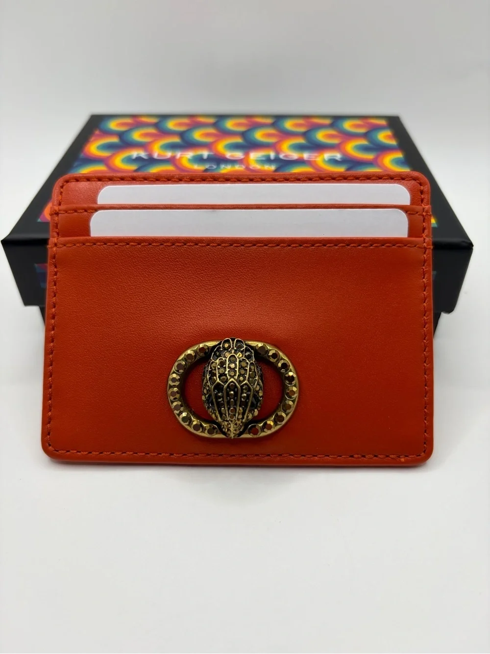 Kurt Geiger Orange Leather Card Holder with Antique Gold Beetle Emblem